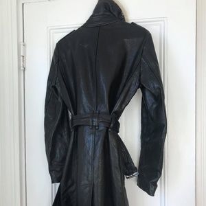 A coat, a jacket, 2 rain coats, a dress